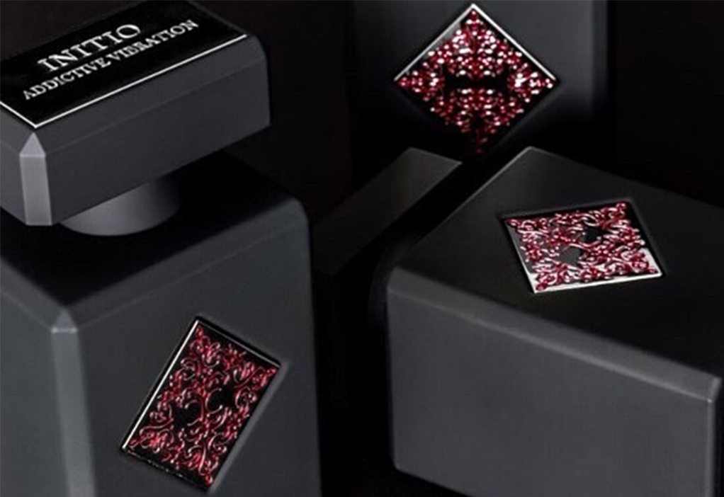 Initio Addictive Vibration luxury perfume bottle in black with elegant red detailing